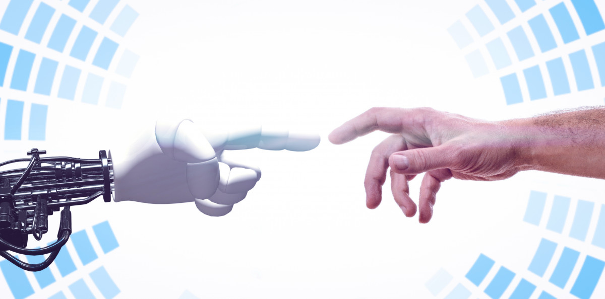 Human hand touching robot hand
